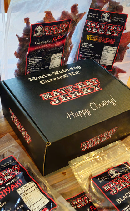 Scary Good Beef Jerky Gift Box (10 bags): Matt-Hat Jerky gift box shown at an angle with bags of beef jerky