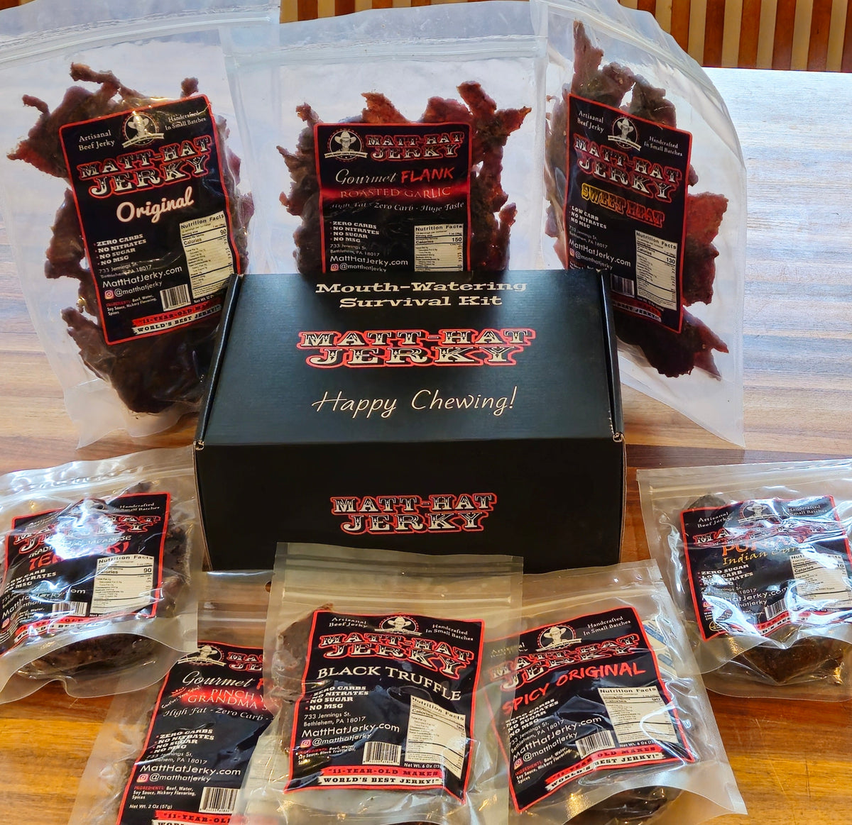 Scary Good Beef Jerky Gift Box (10 bags): Matt-Hat Jerky gift box and bags of beef jerky laid out on a table