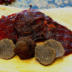 Matt-Hat's Black Truffle Beef Jerky sitting on a table.