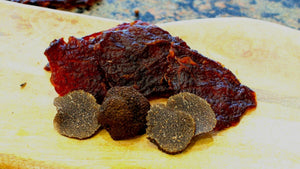 Matt-Hat's Black Truffle Beef Jerky sitting on a table.